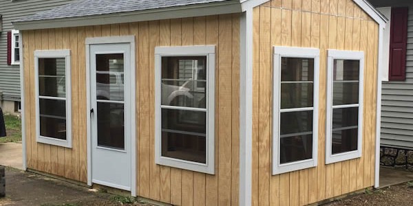 backyard shed with screened windows