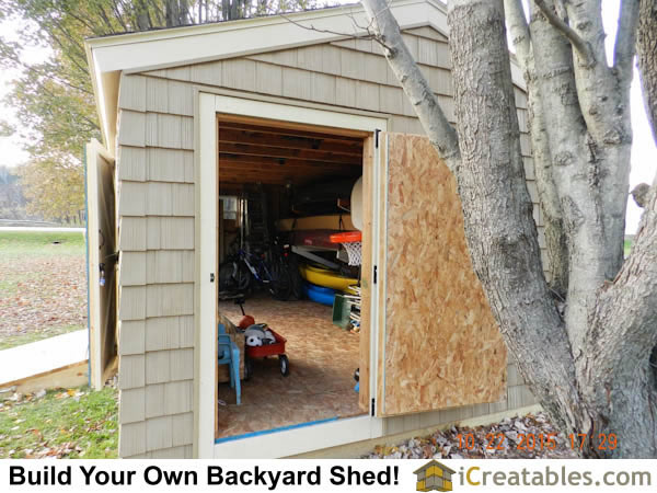 12x20 End door open showing massive amount of shed storage space.