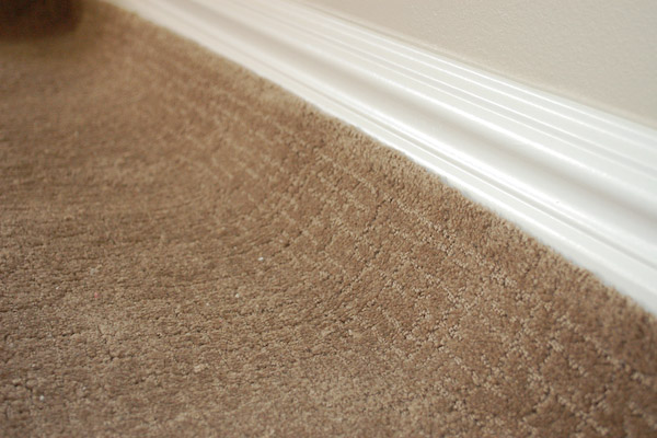 carpet laid on floor rolled up wall